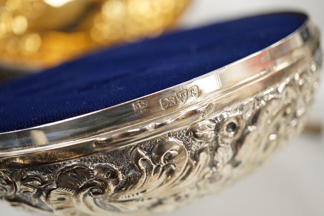 A George V engraved silver rectangular tea caddy, by Nathan & Hayes, Chester, 1913, 81mm, together with an Edwardian repousse silver mounted ring box by Nathan & Hayes, Chester, 1905, a Scottish silver and tortoiseshell